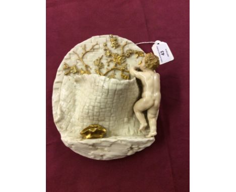 A Royal Worcester porcelain wall pocket, mounted with a figure of a boy holding a hammer