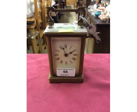 A brass cased carriage clock
