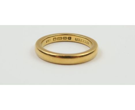 A 22ct gold wedding band, 2.9mm wide, finger size K, 5.39g gross