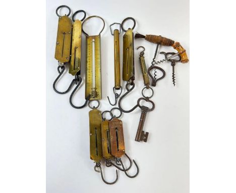 A collection of Victorian and later corkscrews, weighing scales and sugar thermometer 