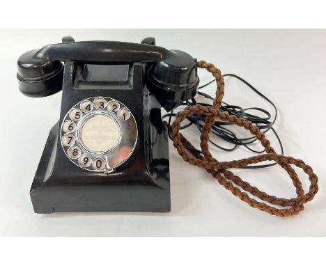 A vintage black bakelite telephone 