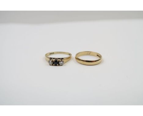 A 9ct gold sapphire and diamond three stone ring, finger size K; together with a 9ct gold wedding band, finger size J, 3.16g 