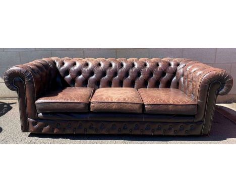 A Chesterfield button back sofa, upholstered in a brown leather, 69cm high, 182cm long, 80cm deep