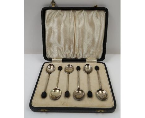 A set of coffee bean end spoons, each bowl back with a different coloured enamel over a fan shaped design, two with Birmingha
