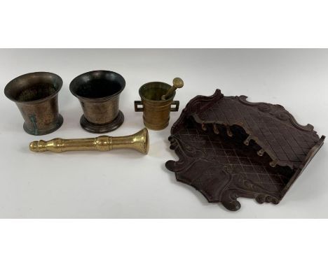 Two pestle and mortars, along with one other mortar and an oak pipe rack 