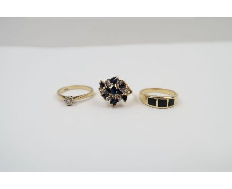 A 9ct gold sapphire and diamond dress ring, finger size O, 3.17g gross; a band ring set with black enamel or onyx, marked '14