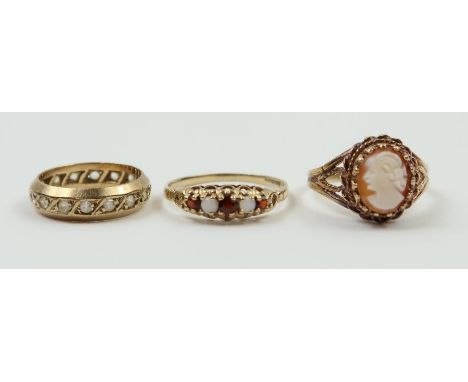 A 9ct gold cameo ring, finger size P; a 9ct gold garnet and opal five stone ring, finger size R 1/2; and a 9ct gold synthetic