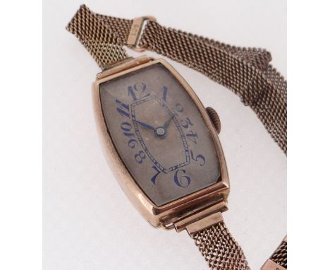 9CT GOLD LADIES ART DECO-STYLE SWISS WRISTWATCH, c. 1923,  tonneau case and silvered dial with blue enamel Arabic numerals, b