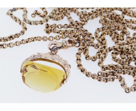 9CT GOLD REVOLVING CITRINE FOB, on long 9ct gold guard chain, 150cms long, 35.3gms overall Provenance: deceased estate Pembro