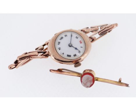 VINTAGE 9CT GOLD ALADIN LADIES WRISTWATCH, white enamel dial with roman indices, gilt minute markers, manual wind signed Swis