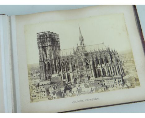 19TH CENTURY ALBUM OF SEPIA PHOTOGRAPHS, red morocco and gilt tooled covers dated 1878, containing appr. 53 sepia photographs
