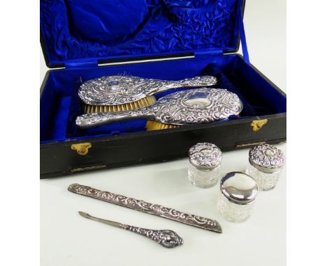 ASSOCIATED VICTORIAN SILVER DRESSING TABLE ACCESSORIES, including two brushes, three covered glass jars, button hook and comb