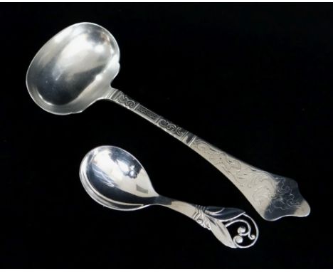 TWO DANISH SILVER SPOONS, comprising a sauce ladle, Christian Heise 1906, designed by A. Andersen, engraved rococo design, re