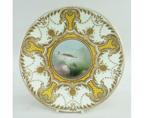 ROYAL WORCESTER CABINET PLATE, 1903, painted by HARRY DAVIS with fish beside rocks, within elaborate raised gilt, yellow and 