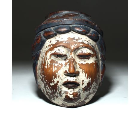 Japan or SE Asia, possibly pre-1603 CE. This is a light wood mask with the hair painted black/blue and the face painted white