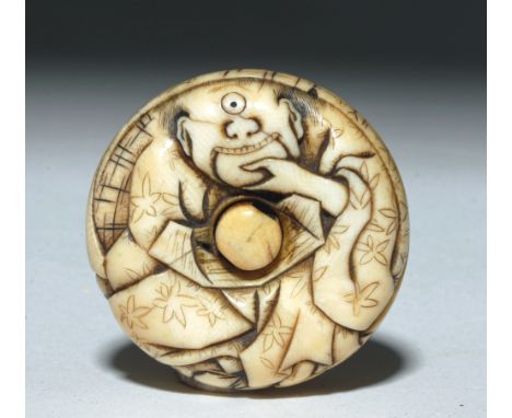 Japan, Edo Period, ca. middle 19th century CE.  Stunning carved ivory netsuke in rounded form, center holed plug to accept hi