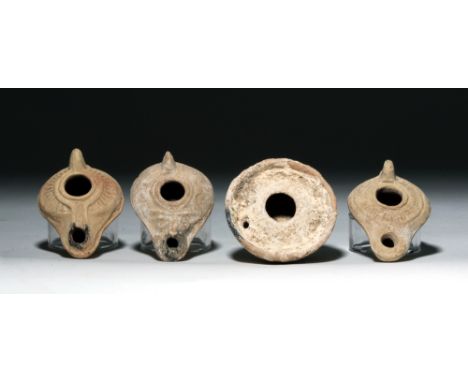 From the ancient Near East, Holyland / Byzantine Empire, ca. 5th to 8th century CE. This group of four oil lamps make a nice 