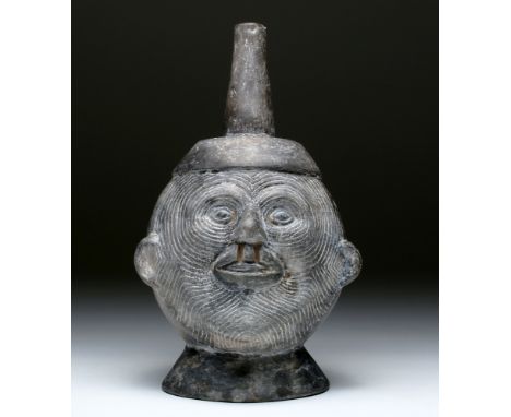 Pre-Columbian, Central Peru, Inca, ca. 1000 to 1500 CE.  A wondrous greyware portrait jar that departs from traditional reali