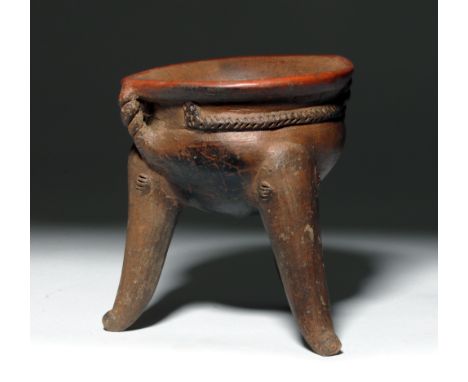 Pre-Columbian, Panama, 800 to 1500 CE.  This is a long, thin-legged tripod pot from the Veraguas region of Panama. It has sma
