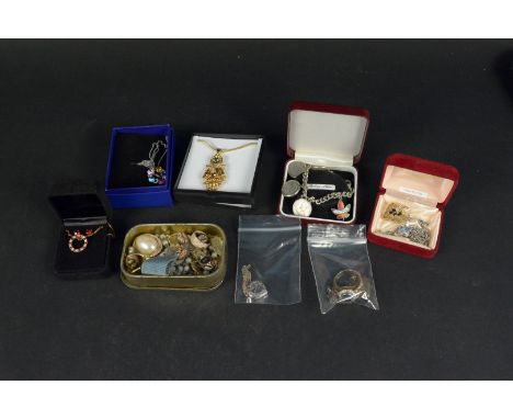 A mixed lot of silver and costume jewellery including two silver heart lockets plus a large silver gilt stone set ring