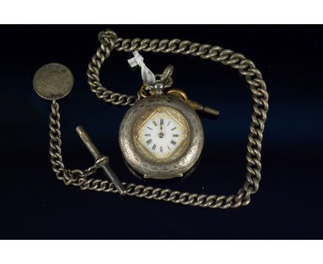 A mixed lot comprising a Swiss silver cased open face, cylinder fob watch, width 36mm, together with a silver graduated curb 