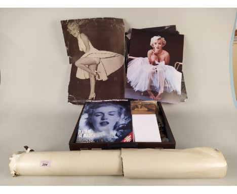 A small suitcase full of Marilyn Monroe ephemera, paper cuttings etc plus a heavy roll of many vintage posters