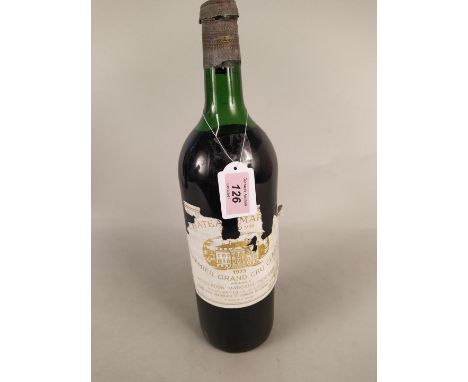 A vintage bottle of 1973 Chateau Margaux Premier Grand Cru Classe 148 cl red wine (top seal broken, cork intact but label dis