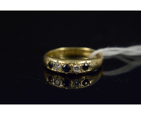 An 18ct gold sapphire and diamond set ring, size N, weight approx 3.8g