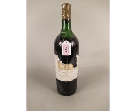 A vintage bottle of 1973 Chateau Margaux Premier Grand Cru Classe 148 cl red wine (top seal taped and label distressed)