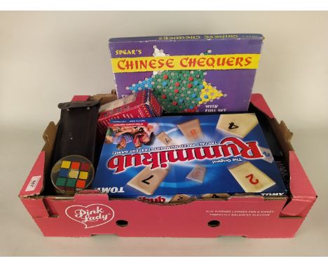 A vintage original Rubik's Cube plus a box of mixed various board games