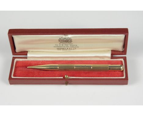 A 9ct gold engine turned propelling pencil, London 1959, length 10.5cm, together with an Asprey fitted box 