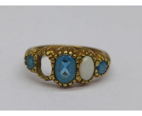 A 9ct gold, blue stone and opal ring, lacking one opal, 2.1g, H