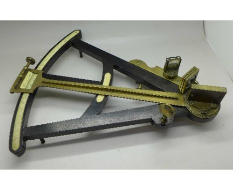 A 19th Century ebony and brass octant with ivory scale