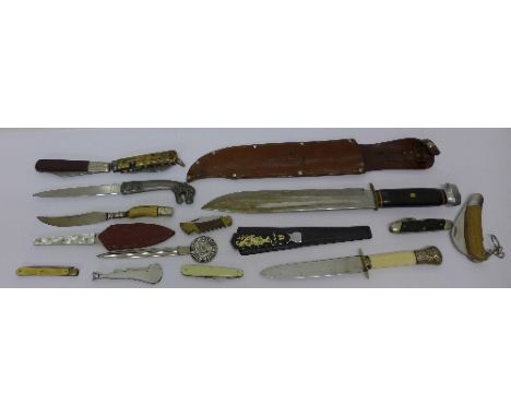 A hunting knife and other knives including paper knives