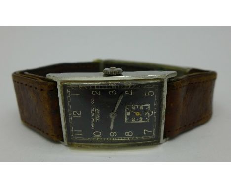 A 1940's Omega Watch Co. Tissot wristwatch with black dial, width of case 21mm