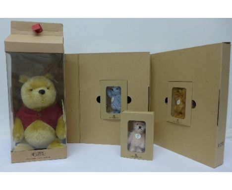 A Steiff Winnie the Pooh and three miniature Steiff bears, boxed