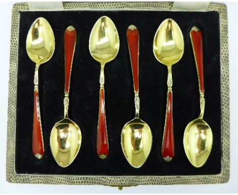 A set of six silver gilt and enamel spoons by Walker & Hall, cased