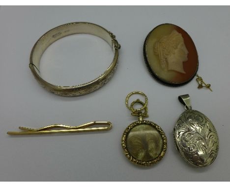 A silver locket, a silver bangle, a cameo brooch, etc.
