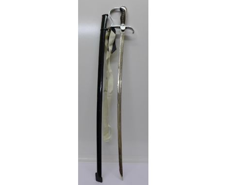 An East German Officers ceremonial sword with scabbard, blade marked Wachregiment Berlin