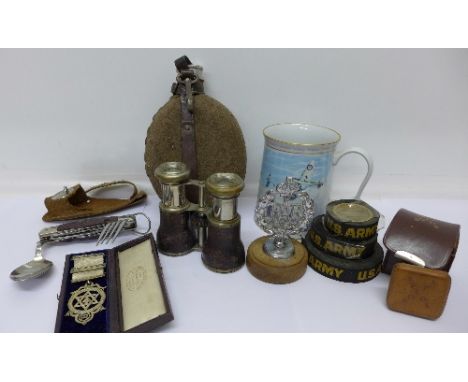 A multi-tool knife with spoon and fork, a water bottle, a pair of Jockey Club binoculars, a chrome RAF badge on stand, three 