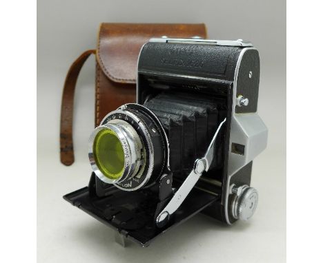 An Ensign folding camera and leather case