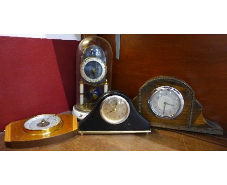 Three clocks, including Kaiser and Enfield and a barometer