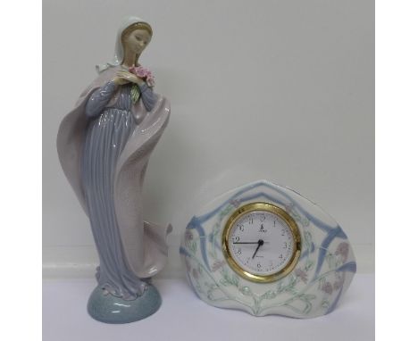 A Lladro figure of a girl holding a bunch of flowers, 5171 backstamp, and a Lladro quartz mantel clock