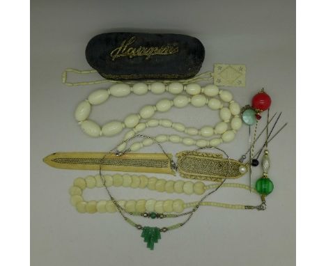 A hairpin box and hair pins, a jade necklet, three other necklaces and a damaged letter opener