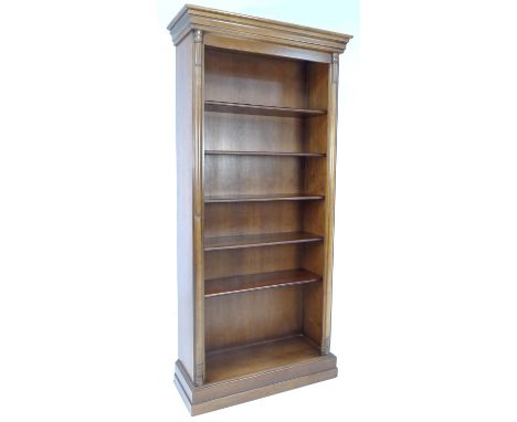 A modern five shelf freestanding bookcase, in the Georgian style with half pilasters to each edge, plinth base, 94 by 37 by 1