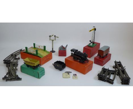 A collection of vintage Hornby Meccano O gauge railway models including a No.50 locomotive, British Railway black livery, rev