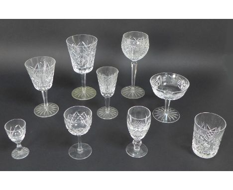 A large collection of Waterford Crystal drinking glasses,  including a suite of table glasses comprising nine red wine glasse