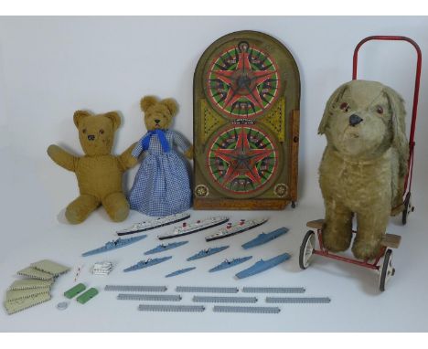 A group of vintage toys comprising a Pedigree Soft Toys Ltd push along ride on dog, 60 by 25 by 61cm high, a Lindstrom's Gold