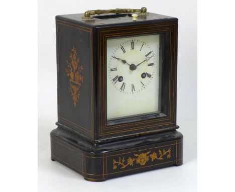 A French 19th century ebonised and marquetry inlaid oak cased mantel clock, with gilt metal carry handle over a glass apertur