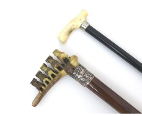 Two late 19th / early 20th century walking sticks, comprising a walking stick with small ivory handle and ebonised shaft, whi